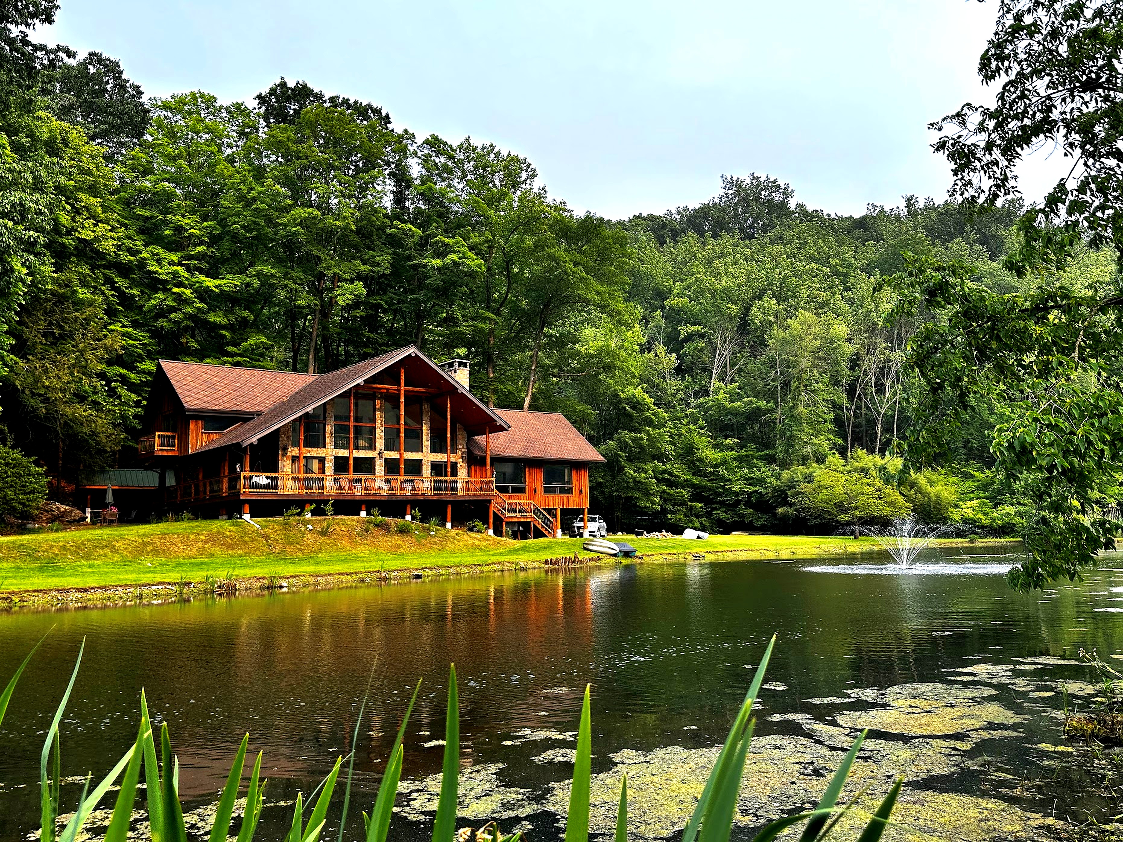 Cabin from the pond with lily pads